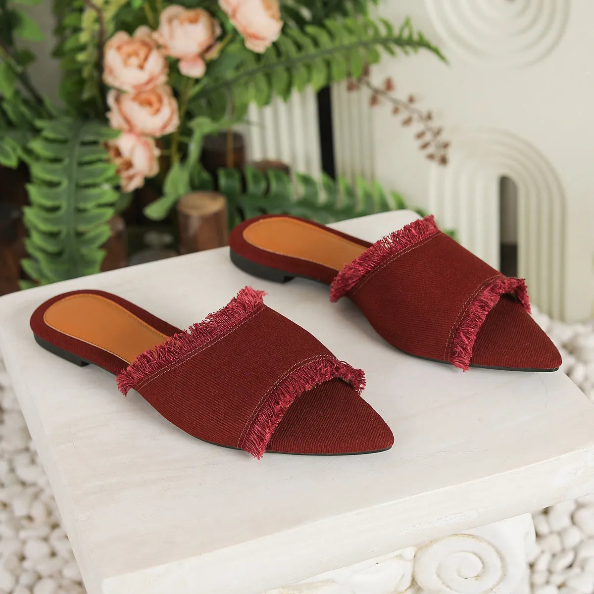 Women's denim flat slippers with leather lining and tassel detail in solid colour