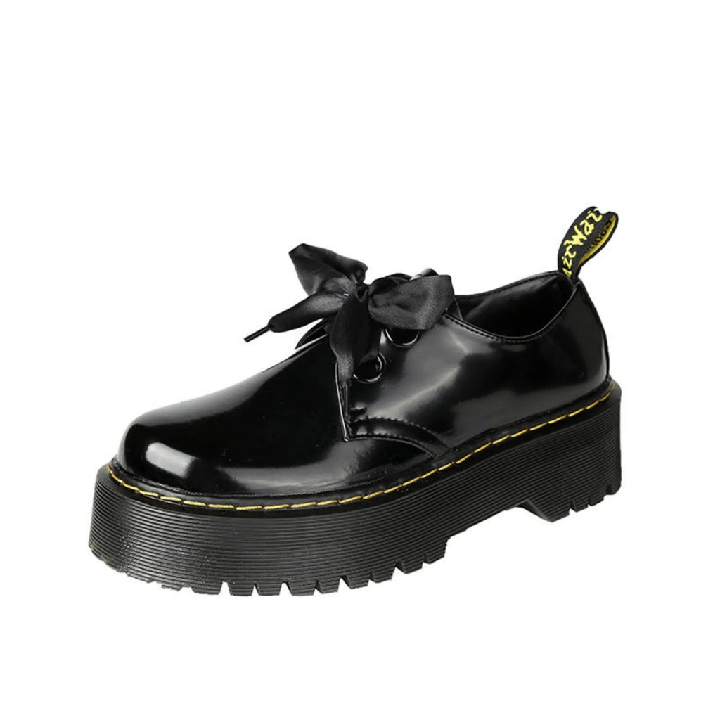 Women's thick soled leather shoes with ribbon details in black and white colour options