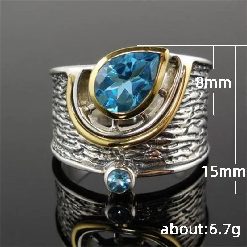 Blue zircon rhinestone ring in Chinese style with drop shape design on woman's hand