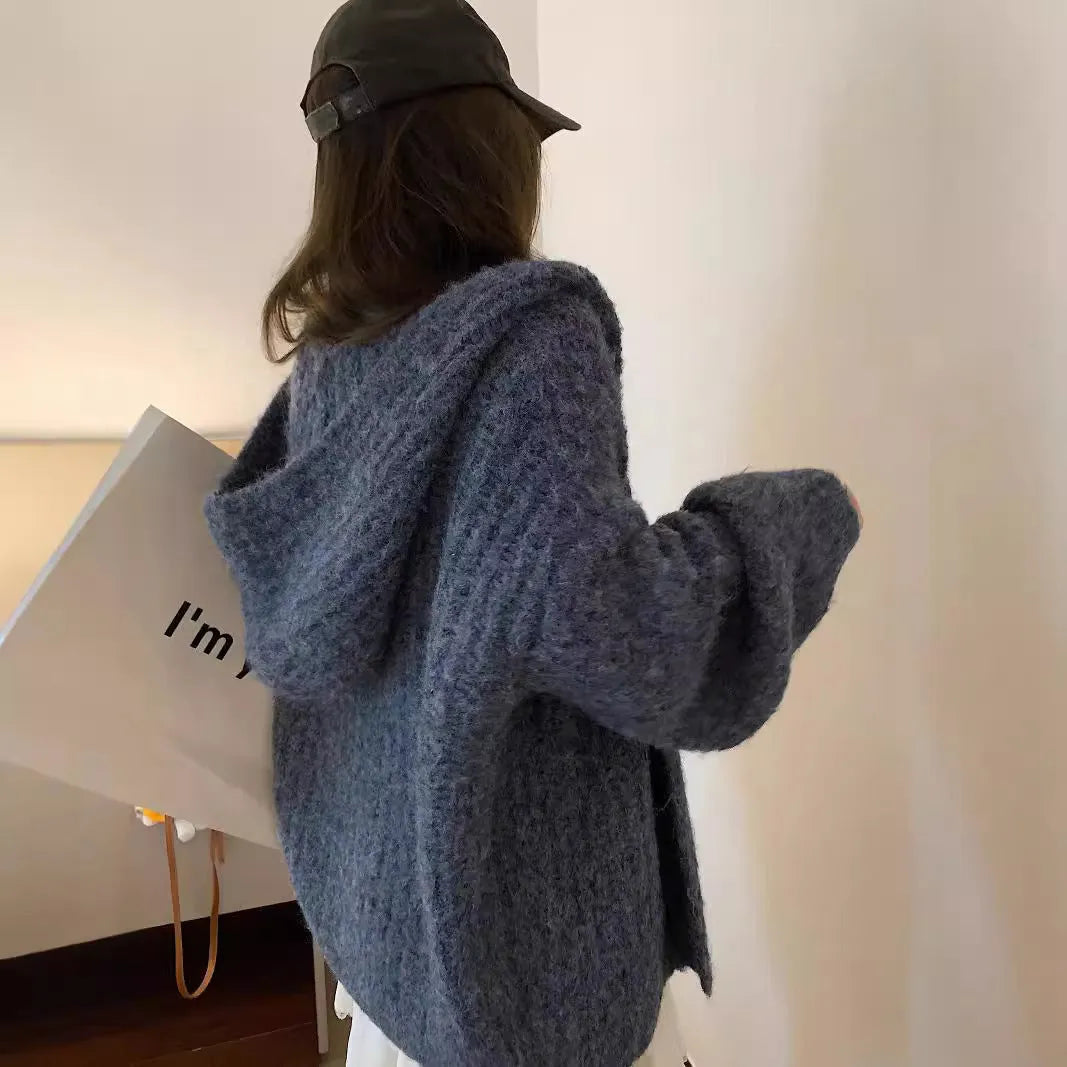 Women's thick grey retro Maillard style hooded cardigan sweater on a hanger