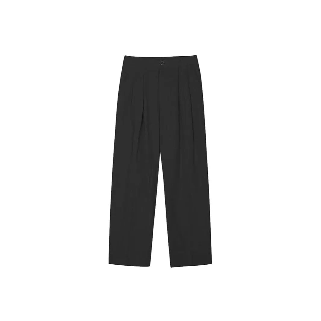 Men's apricot coloured loose-fit cotton linen blend trousers on a hanger, showing zip fly and mid-waist design.