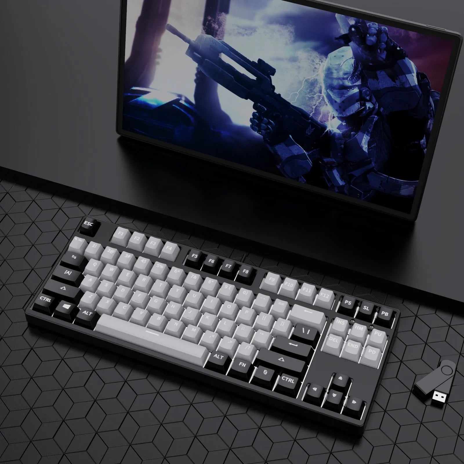 87 key wired mechanical keyboard with metal chassis shown in a black, orange, and yellow colour configuration.