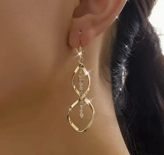 Gold spiral geometric earrings with ellipse diamond-style ornament for women