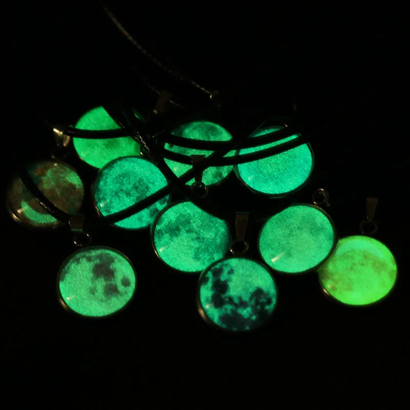 Luminous moon and constellation pendant necklace on a chain with an extension, shown in one of ten possible colours.