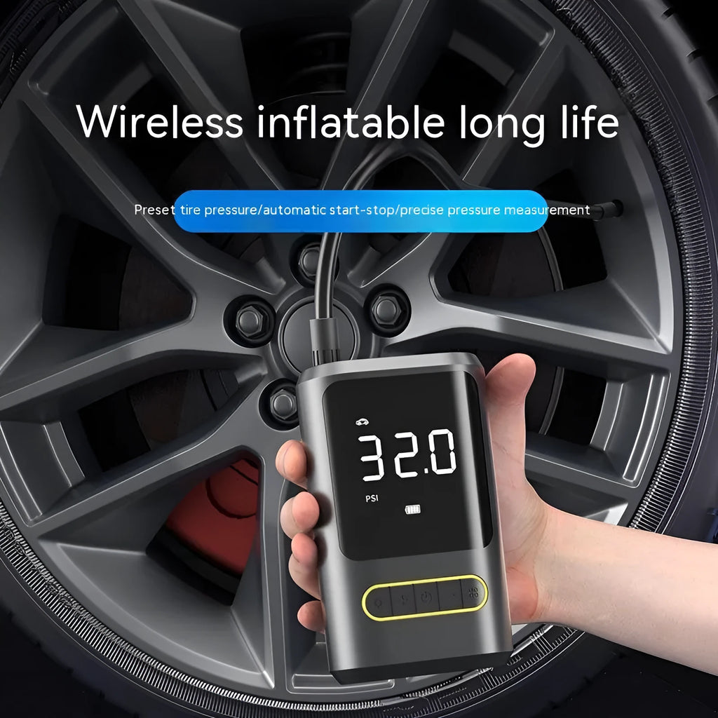 Black handheld wireless digital tyre inflator with LED display and flexible hose on a grey background.