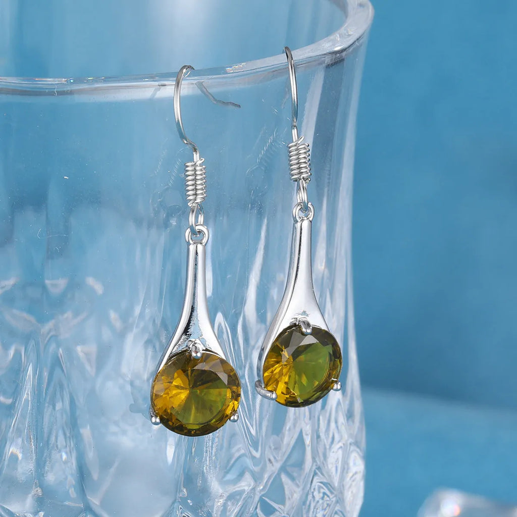 Olive green topaz drop earrings with water shape design and retro style on alloy background