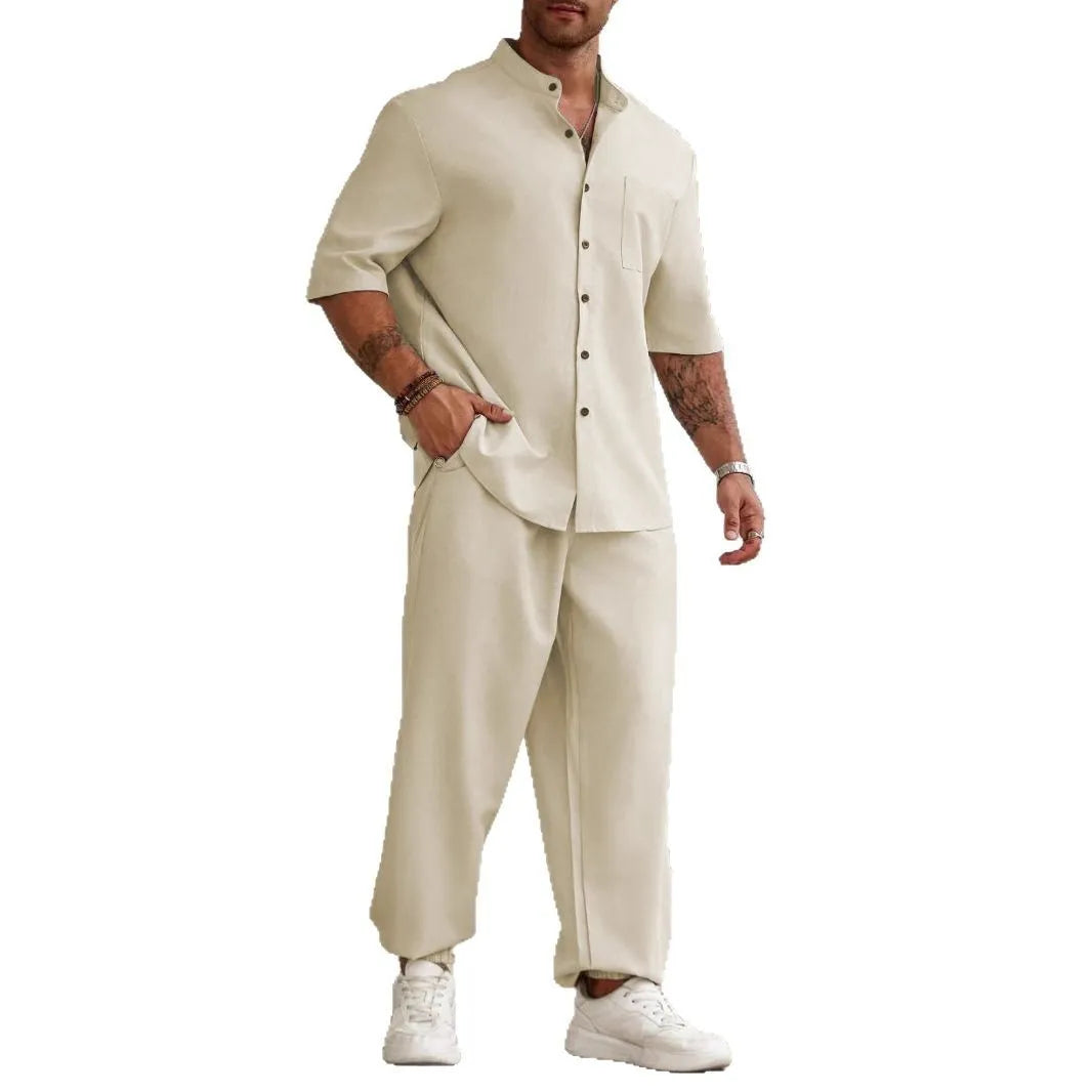 Men's apricot coloured cotton linen short sleeve shirt and matching casual trousers laid flat.
