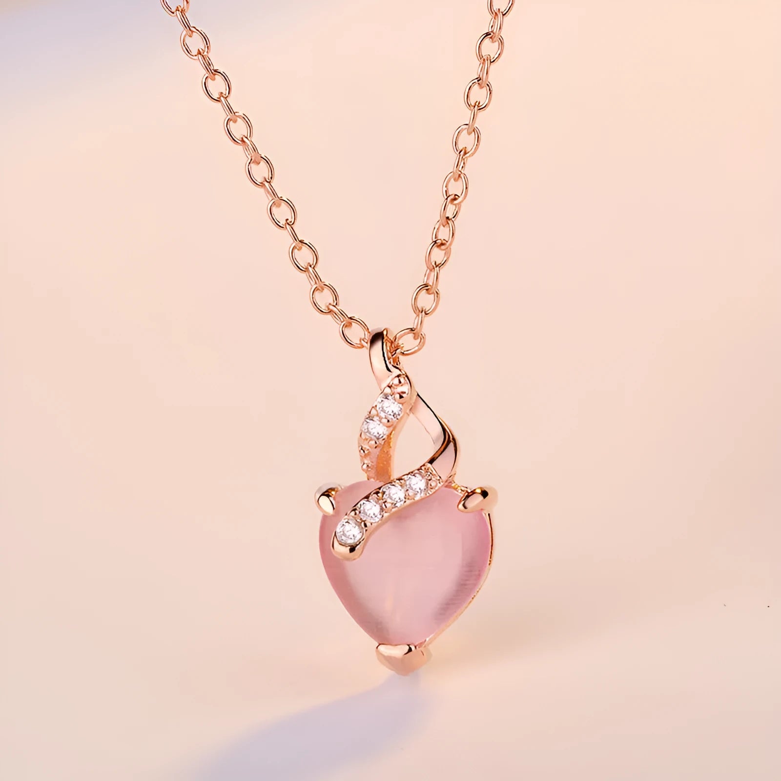 Women's heart-shaped pink artificial crystal pendant necklace with rose gold cross chain