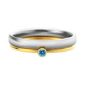 Close-up of a titanium steel engraved ring in a geometry shape, styled for the December birthstone colour.