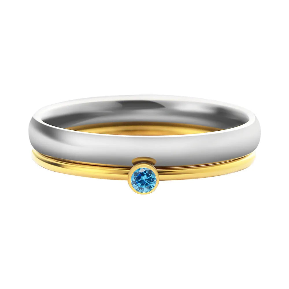 Close-up of a titanium steel engraved ring in a geometry shape, styled for the December birthstone colour.