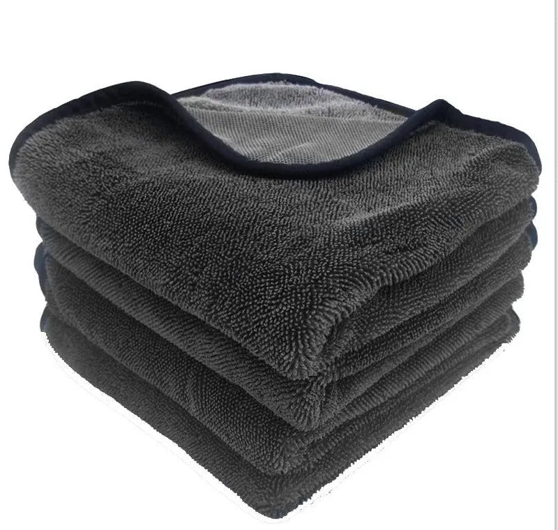 Grey car cleaning towel with black trim edge in various sizes from 20x30cm to 60x160cm.