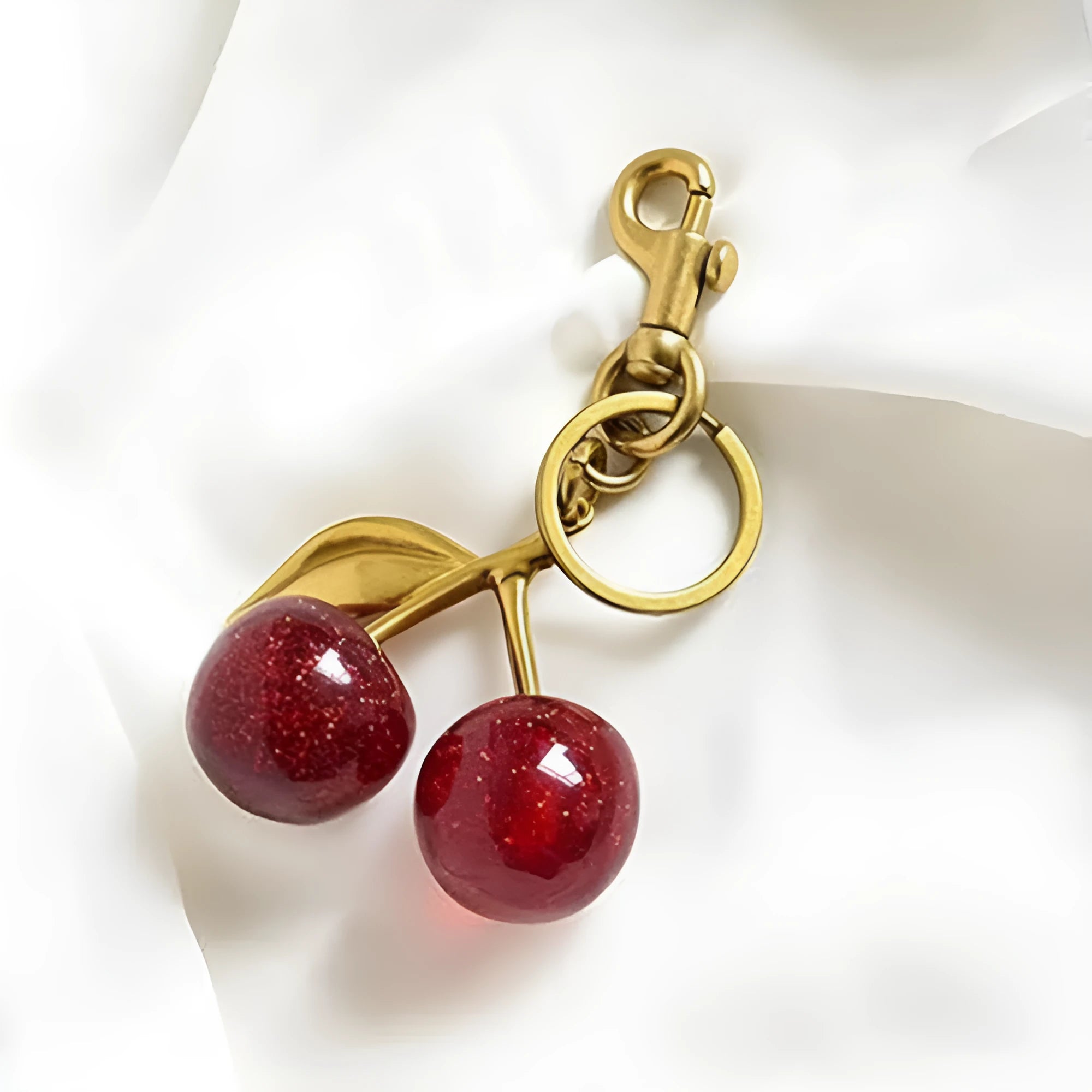 Alloy three-dimensional cherry design key ring pendant in red or pink colour options