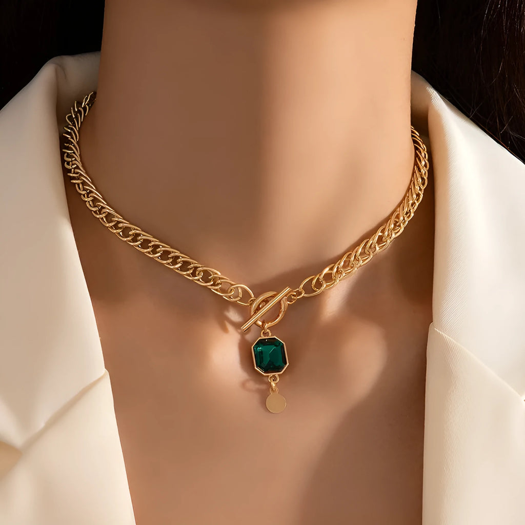 Gold electroplated titanium steel necklace with geometric round pendant and Cuban link chain