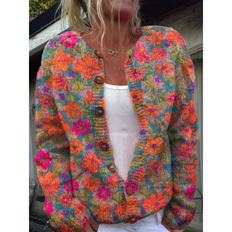 Yellow digital print cardigan knit coat with a raised 3D pattern on a hanger.