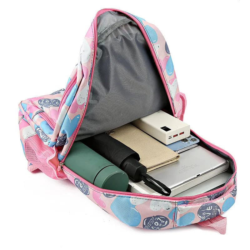 Blue children's schoolbag with air pillow shoulder straps and Oxford cloth exterior.