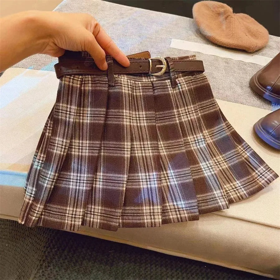 Girls plaid pleated A-line skirt in cotton-blend fabric on a hanger.