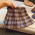 Girls plaid pleated A-line skirt in cotton-blend fabric on a hanger.