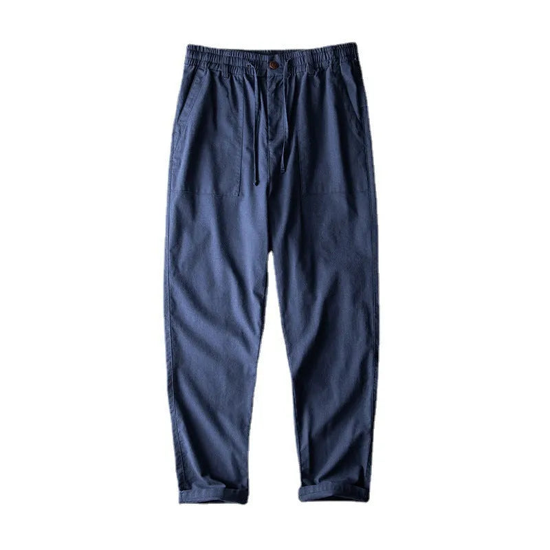 Men's linen casual trousers in solid colour with mid waist design and traditional trouser length