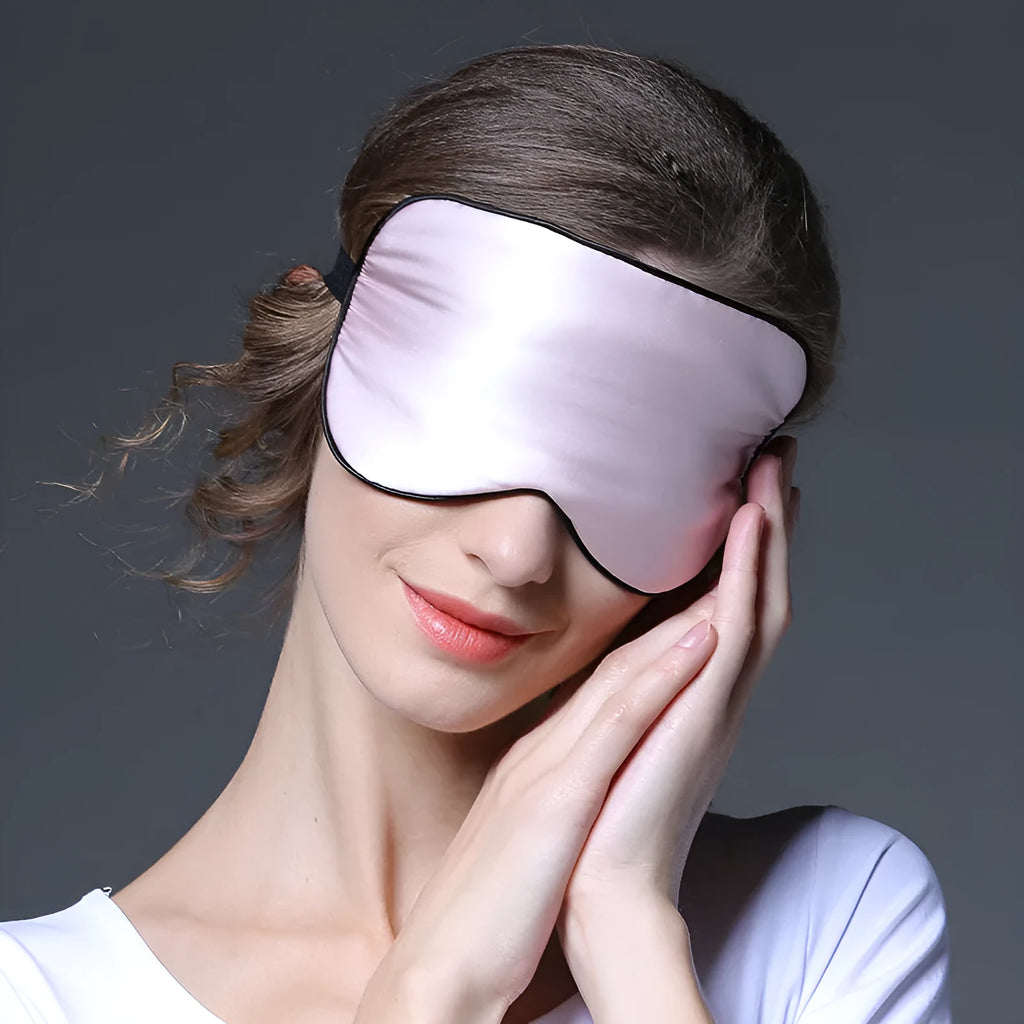 Double-sided mulberry silk sleep mask in multiple colours showing embroidered print and adjustable strap.