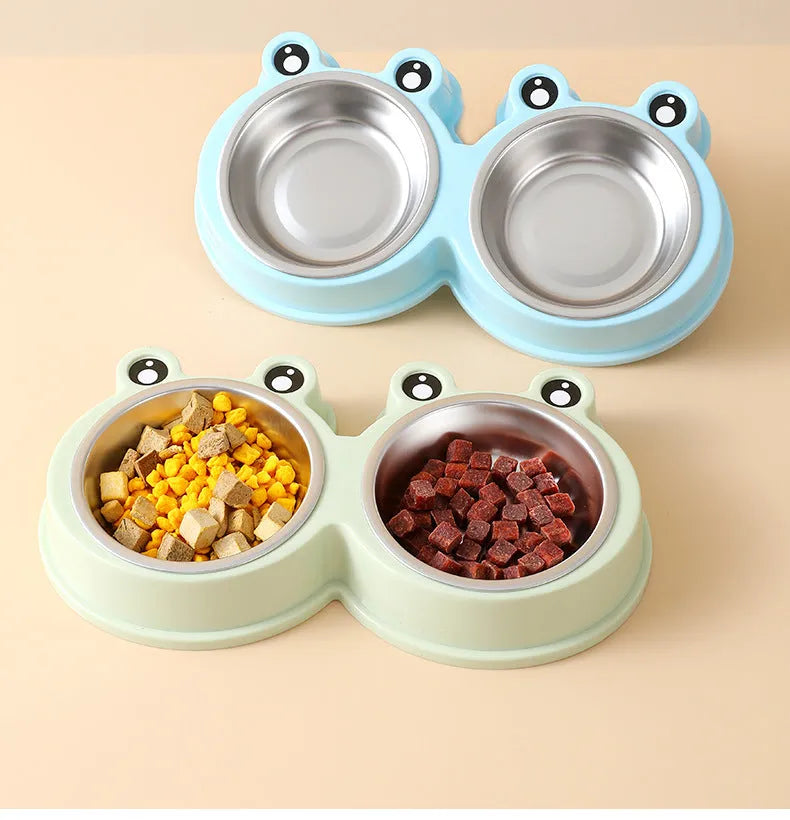 Stainless steel double pet bowl with frog-shaped non-slip base in blue, green, and pink colours
