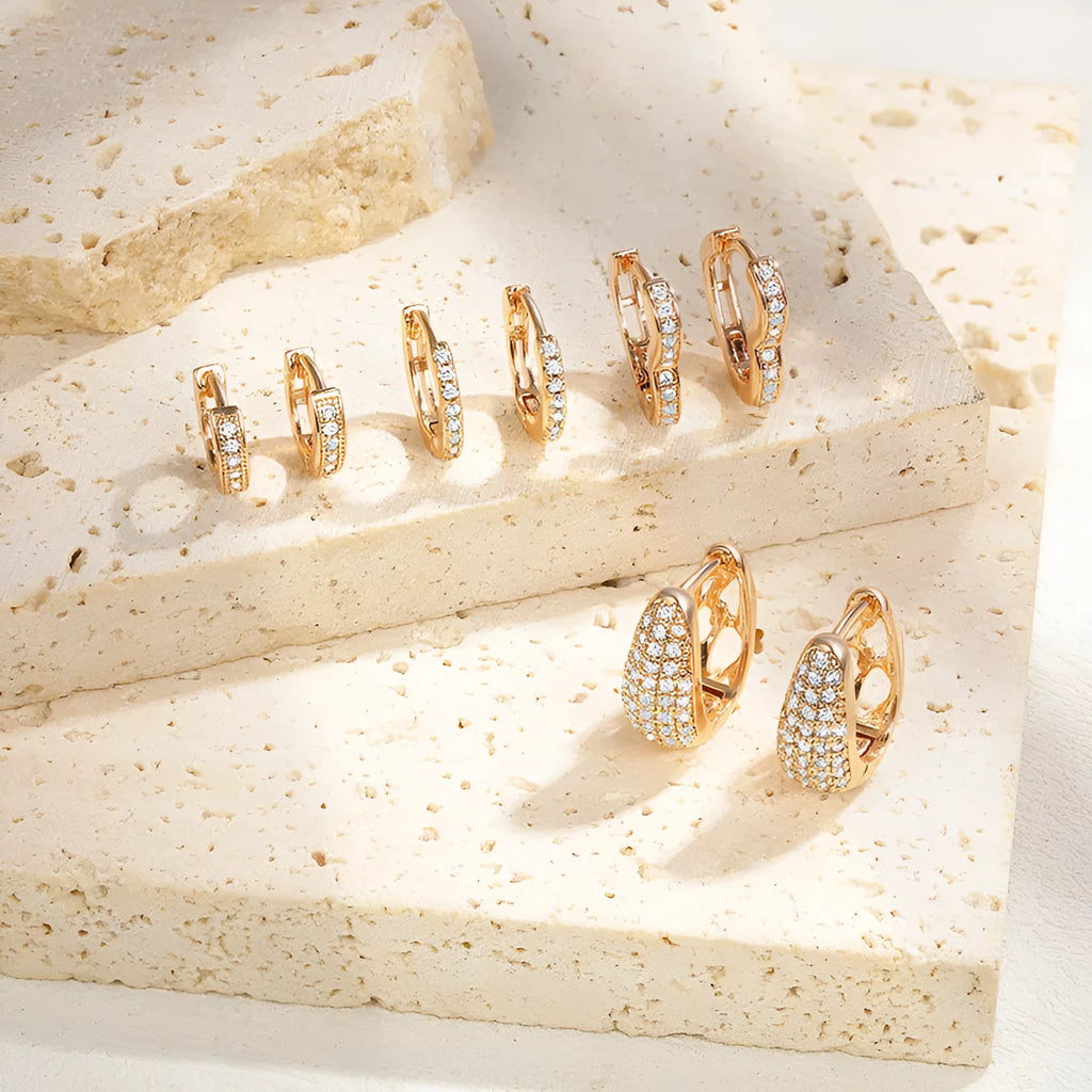 Gold plated heart-shaped zircon ear clip earrings for women on a white background