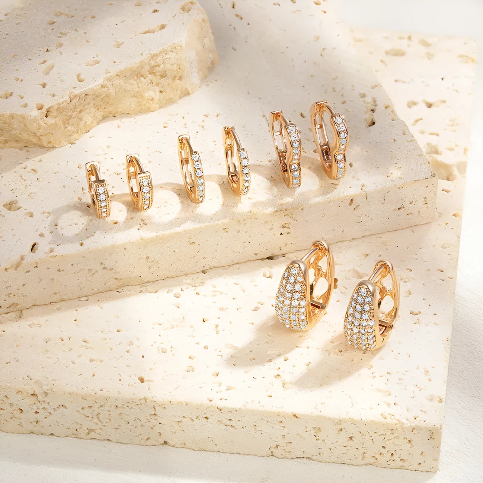 Gold plated heart-shaped zircon ear clip earrings for women on a white background