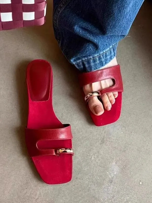 Square toe leather outdoor slipper in multiple colours on a plain background.