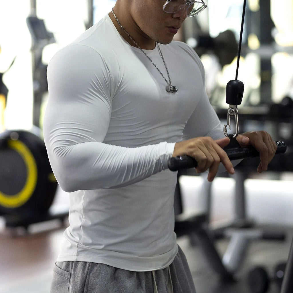 Men's black long sleeve fitness compression tights for running and gym workouts