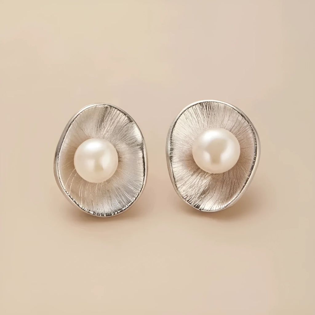 Pearl sterling silver needle earrings with geometric design and electroplated gold finish