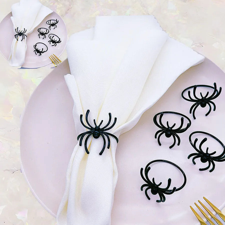 Six black spider-shaped alloy napkin rings for Halloween table decoration